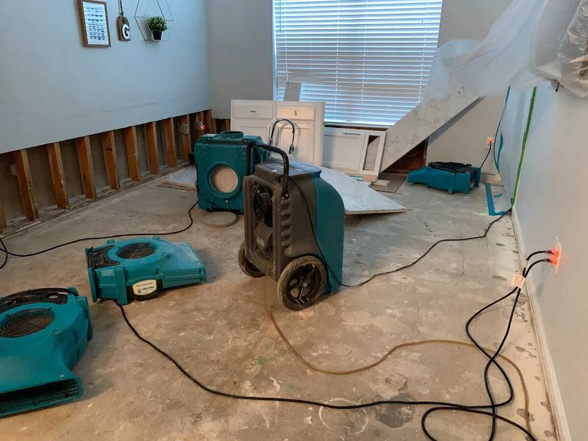 Dehumidifier in flood-cut room for Water Damage Restoration in Kendall